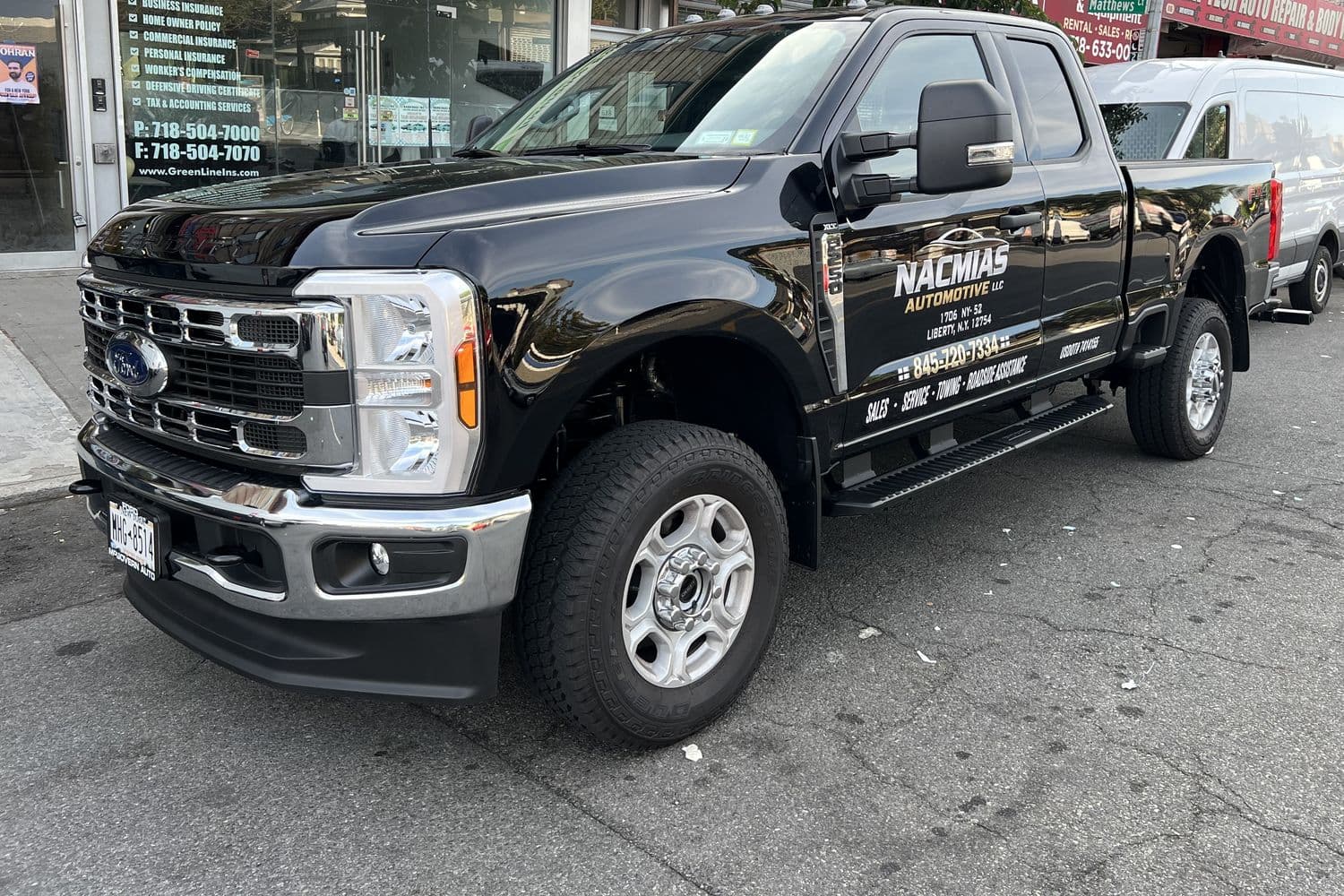 A Nacmias Automotive LLC truck parked on Coney Island Avenue in Brooklyn